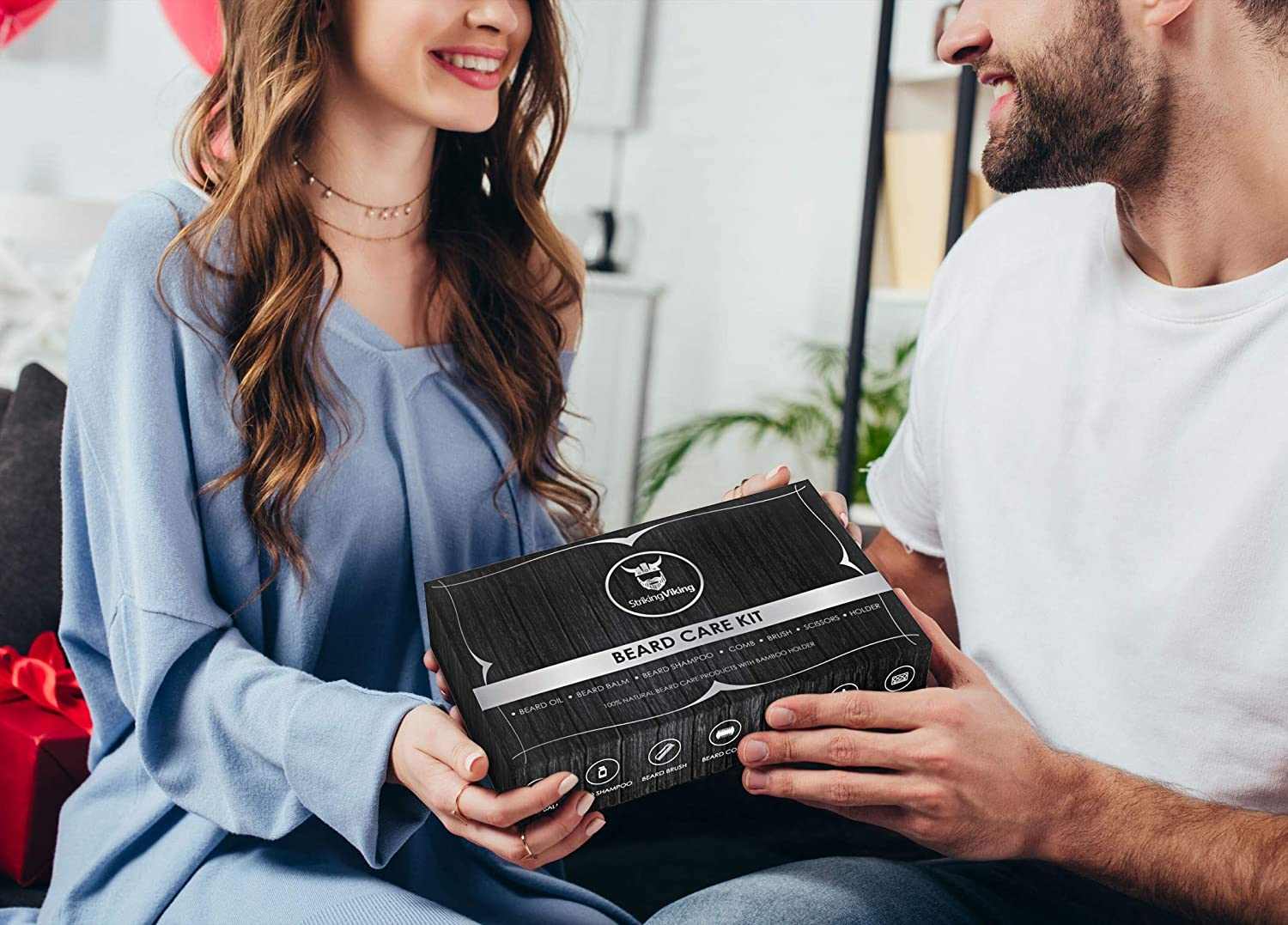 Beard kit with caddy in a sleek gift box exchanged between two people.