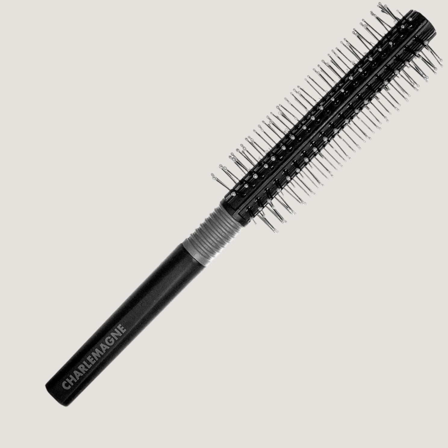 Black round hair brush with ball-tipped bristles and rubberized grip for smooth, tangle-free styling and blow-drying medium to long hair