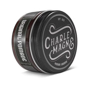 A black metal tin of Charle Magn& Original Pomade, showing the front label and side label, on a white background.