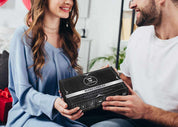 Beard kit with caddy in a sleek gift box exchanged between two people.